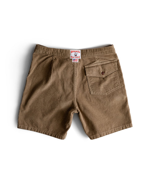 The Classic Corduroy Shorts - Acorn are shown from the back with two pockets—one on the left, a buttoned pocket on the right, and a visible brand label on the waistband, all displayed against a white background.