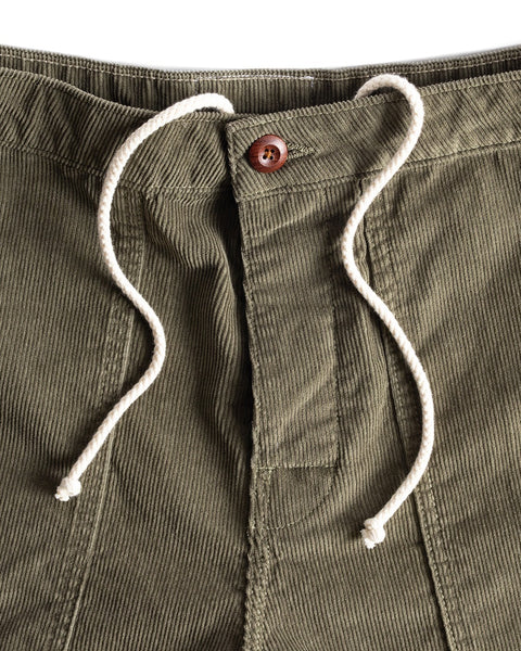 Close-up of Classic Corduroy Shorts - Olive, highlighting the brown button, white drawcord waist, detailed pocket stitching, and fine corduroy texture.