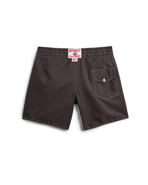 Brown shorts with a visible brand label on a white background