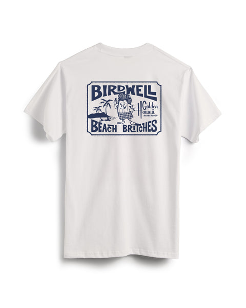 The Golden Hawaii T-Shirt - Vintage White features a large navy blue cartoon bird graphic in swim trunks by palm trees and vintage-style text, Birdwell Beach Britches and Golden Quail, from the Golden Hawaii x Birdwell collab.