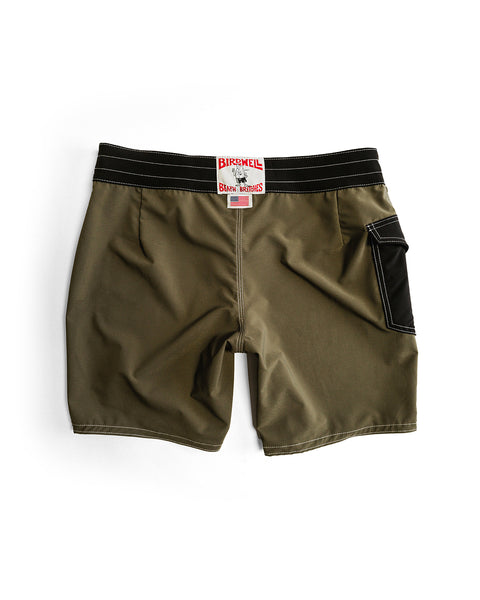 808 Powerbird - Dark Olive boardshorts featuring olive green SurfStretch fabric, black waistband, white stitching, black side pocket, and a red-and-white Birdwell patch above the back waist. Medium length; shown laid flat on a white background.