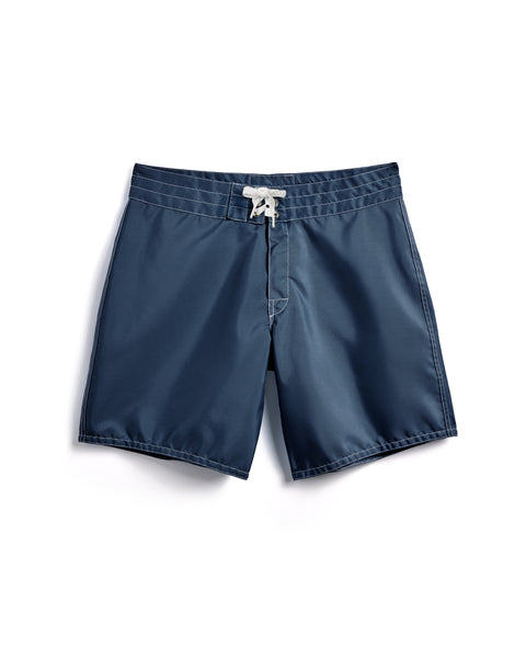 The 300 Boardshorts - Navy feature a white drawstring waistband and are shown laid flat on a white background. Made in the USA, these water-repellent boardshorts offer style and durability for aquatic adventures.