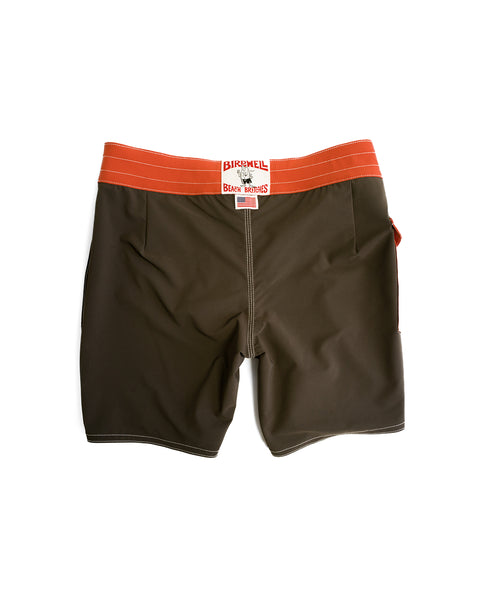 Brown 808 Pop Pocket boardshorts with a paprika waistband and white stitching, featuring a Birdwell Beach Britches label on the back. These water-repellent boardshorts are made in the USA and shown laid flat on a white background.