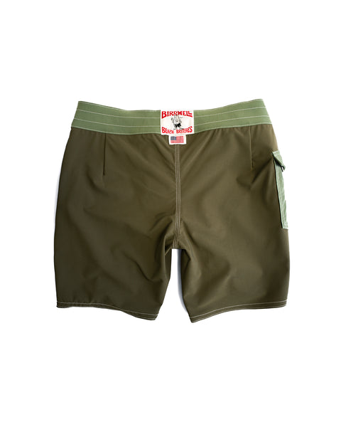 The 808 Pop Pocket in Dark Olive/Olive features an olive green design with a light green waistband and side pocket, a Birchwell Shark Bros label at the center, and is made from SurfStretch fabric. Photographed on a white background.