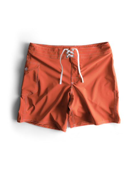 808 SurfStretch Side Pocket Boardshorts in Paprika with white drawstrings and a side pocket, displayed flat on a white background. These medium-length boardshorts are made in the USA.