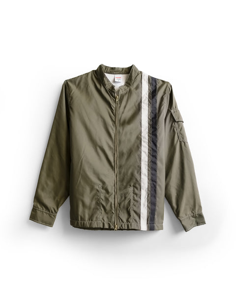 Racing Jacket 26 in Dark Olive/Bone/Black features a front zipper, two vertical stripes—one bone and one black—down the right side, a small collar, and a zippered pocket on the left sleeve. Inspired by classic Racing Jacket styles.
