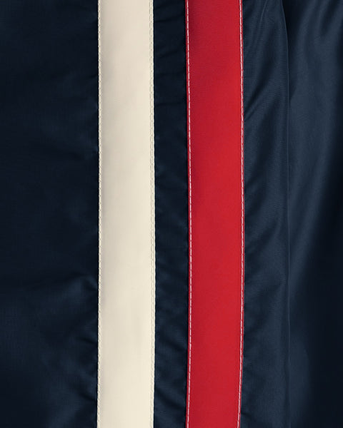 Close-up of the Racing Jacket 26 - Navy/Bone/Red fabric, featuring a cream (bone) stripe and a red stripe flanked by dark navy on both sides. Reminiscent of classic racing jacket designs, the stripes are accented with visible stitching along the edges.