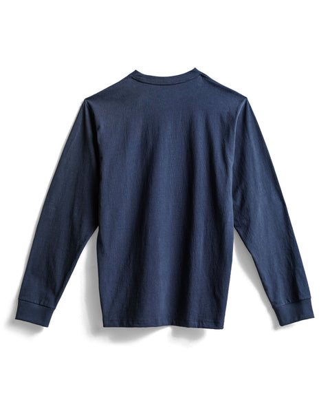 The High Tee Pocket Long Sleeve - Navy is laid flat with the back facing up. Made in the USA from 100% cotton, this shirt features a crew neckline, ribbed cuffs, and a long-sleeve design.