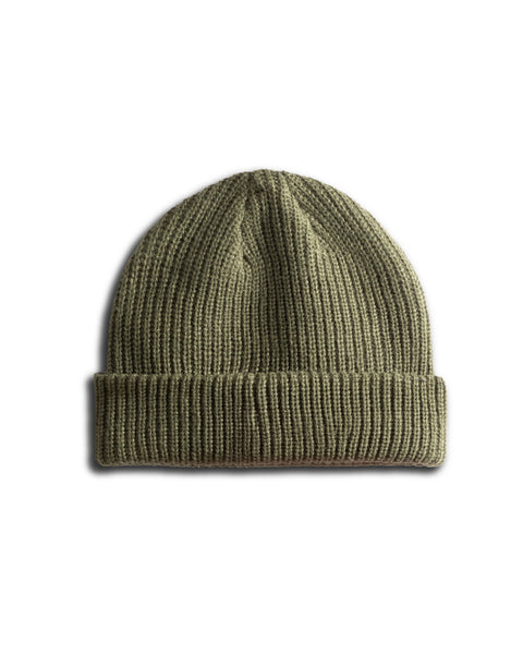 The Potato Watchcap - Army is a knitted olive green ribbed beanie hat featuring a folded cuffed hem, displayed on a white background.