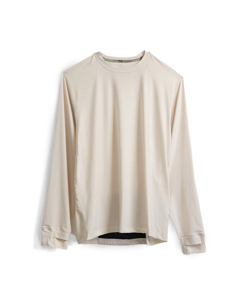 The Sunteez Long Sleeve - Bone is a beige, long-sleeve crew neck shirt displayed against a white background. Made from performance stretch fabric, it features a relaxed fit with clean cuffs and a minimalist design free of visible logos or patterns.