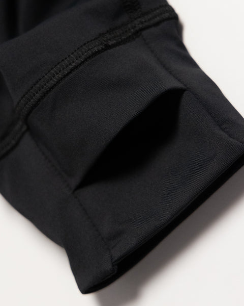 Close-up of the cuff on the Sunteez Long Sleeve - Black, highlighting detailed stitching and the smooth performance stretch fabric texture against a white background.
