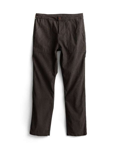 Classic Corduroy Pants - Brown in dark brown corduroy, featuring a button fly and two large front patch pockets.