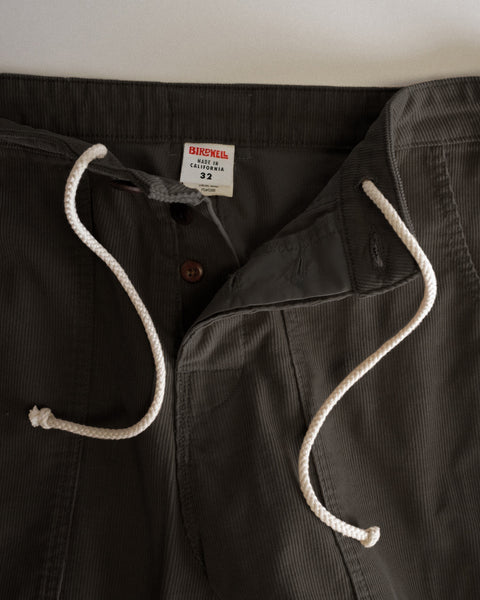 Classic Corduroy Pants - Brown featuring a button fly and white drawstring waistband.