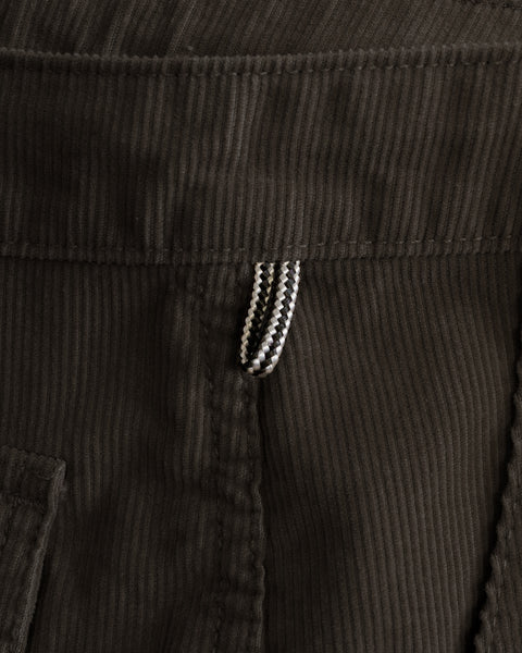 Close-up of Classic Corduroy Pants - Brown featuring a small, patterned loop at the waistband.