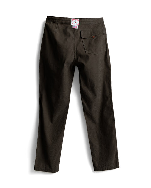 Back view of brown Classic Corduroy Pants featuring a button-flap back pocket and a branded waistband label.