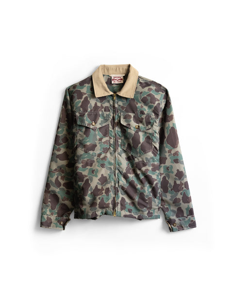 American-made Capistrano Jacket - Frogskin/Acorn in camo-print with a tan corduroy collar and two chest pockets.