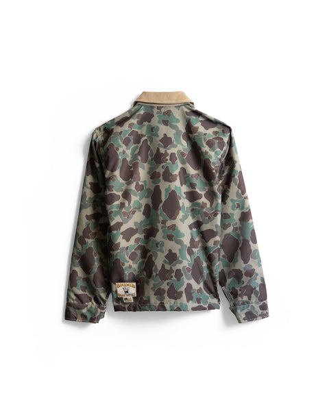 Back view of the Capistrano Jacket - Frogskin/Acorn in a camouflage print with a tan collar and a small brand label on the lower left hem.