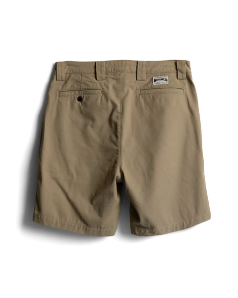 Back view of Stockman Chino Shorts - Khaki in cotton twill, featuring belt loops, a single buttoned rear pocket, and a small brand label above the right pocket.