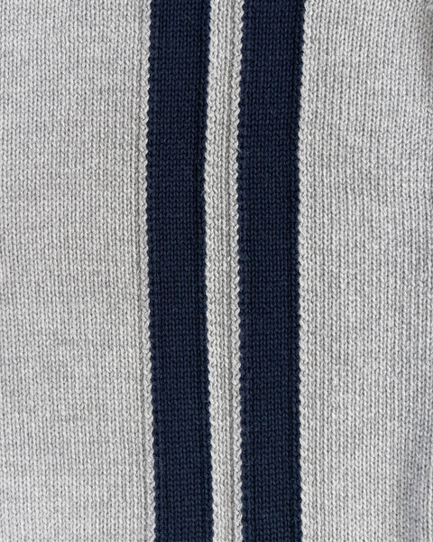 Close-up of the Racing Cardigan Sweater - Gray/Navy, highlighting its soft cotton blend knit with two vertical navy stripes on a light gray background and detailed texture for a cozy look.