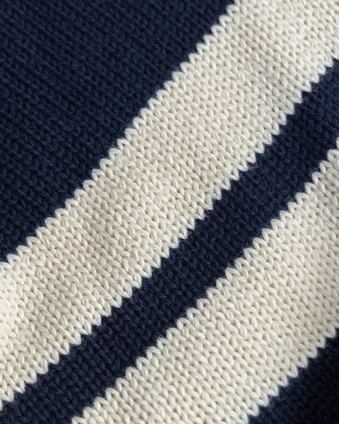 Close-up of the Comp Stripe Sweater - Navy/Bone, highlighting its durable knit with alternating navy and bone stripes, textured pattern, and visible yarn stitches.
