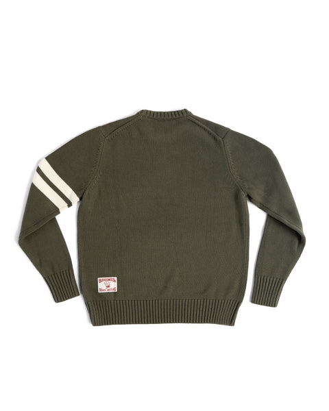 The Comp Stripe Sweater - Dark Olive/Bone is a 100% cotton sweater with two bone stripes on the left sleeve, ribbed cuffs and hem, and a rectangular patch by the back hem. Shown laid flat with the back facing up.