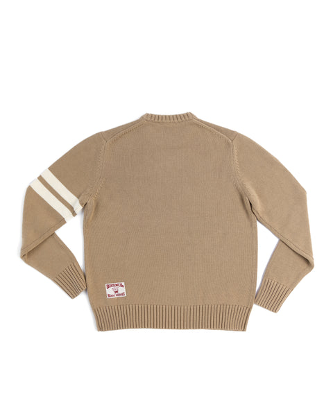 The Comp Stripe Sweater - Bark/Bone is a beige 100% cotton sweater with two white stripes on the left sleeve, ribbed cuffs and hem, and a back hem patch. Knit construction shown flat to highlight the back view.