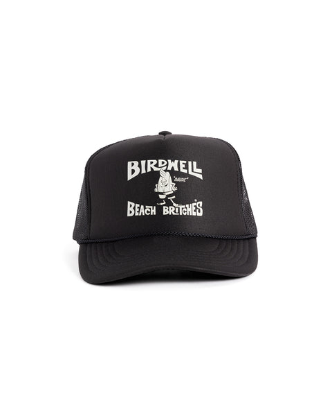The License Plate Trucker - Black is a 5-panel foam trucker hat with white mesh sides and a front graphic featuring 