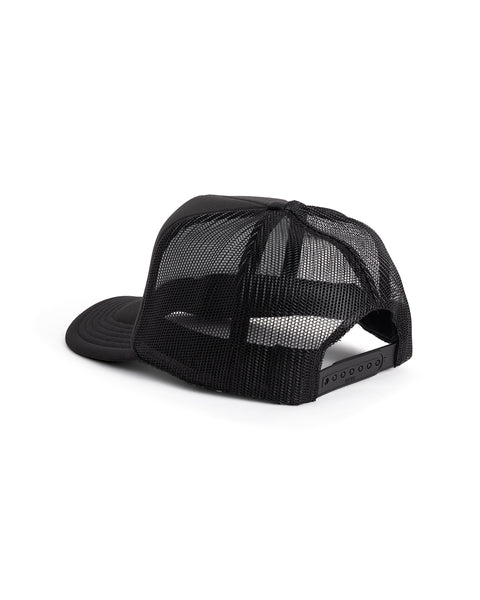 The License Plate Trucker - Black is a black 5-panel mesh trucker hat shown backward, highlighting its adjustable snapback closure and breathable mesh crown.