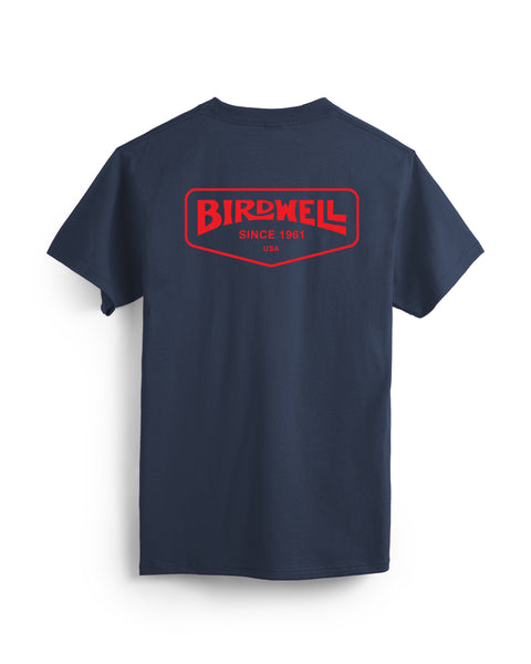 The Service T-Shirt - Navy is a heavyweight, garment-dyed cotton tee featuring a large red and white Birdwell Since 1961 USA logo on the back. Shown against a white background.