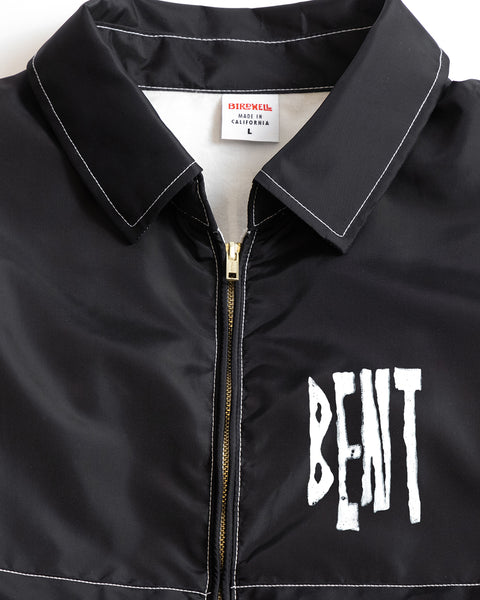 The BENT Comp Jacket - Black is a black zip-up SurfNyl jacket with white contrast stitching and 